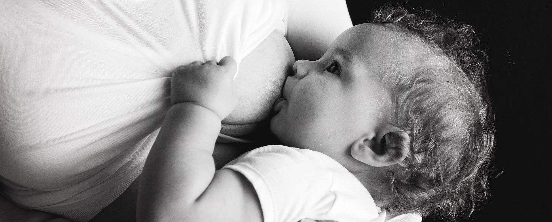 Image of a baby breastfeeding